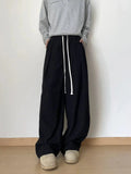 Tryess- Relaxed Fit Pleated Drawstring Pants